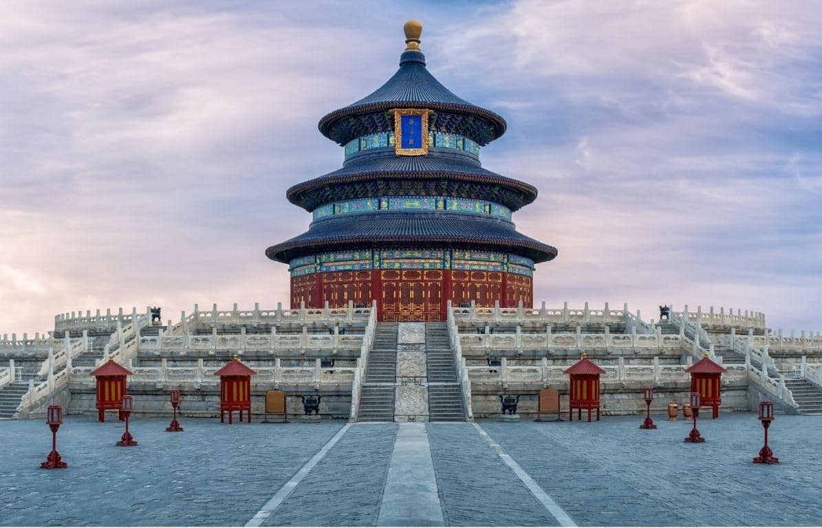 Traditional Chinese Beijing Temple of Heaven with a blue roof against a cloudy sky